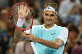 All class ... Roger Federer acknowledges the Pat Rafter Arena crowd after beating Grigor Dimitrov