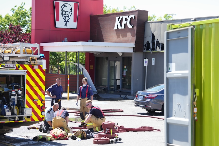 Firefighters outside a KFC.