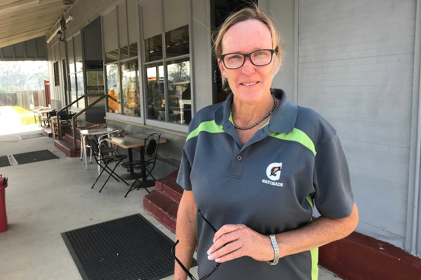 Julie Beel stands outside her cafe