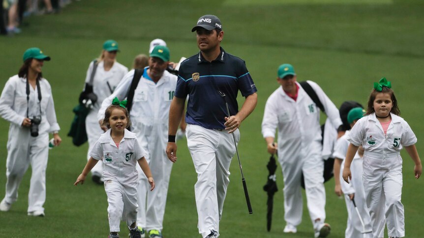 Louis Oosthuizen walks the Augusta fairway with his kids