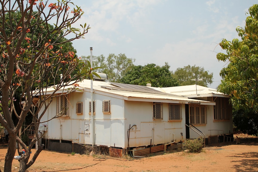 The home of Indigenous pensioner Leonard O'Meara, surrounded by red earth and bushy trees.