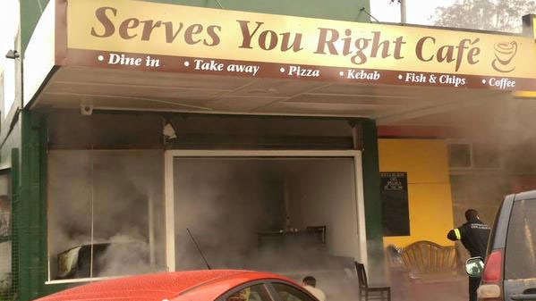 Firefighters at smoky Serves You Right Cafe in Ravenshoe after a gas explosion.