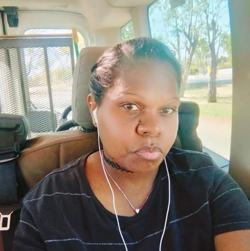 an aboriginal woman wearing headphones