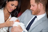 Prince Harry and Meghan, Duchess of Sussex hold their baby son.