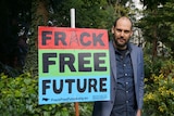Piers Verstegen holds a sign reading "Fracking Free Future". July 22, 2017.