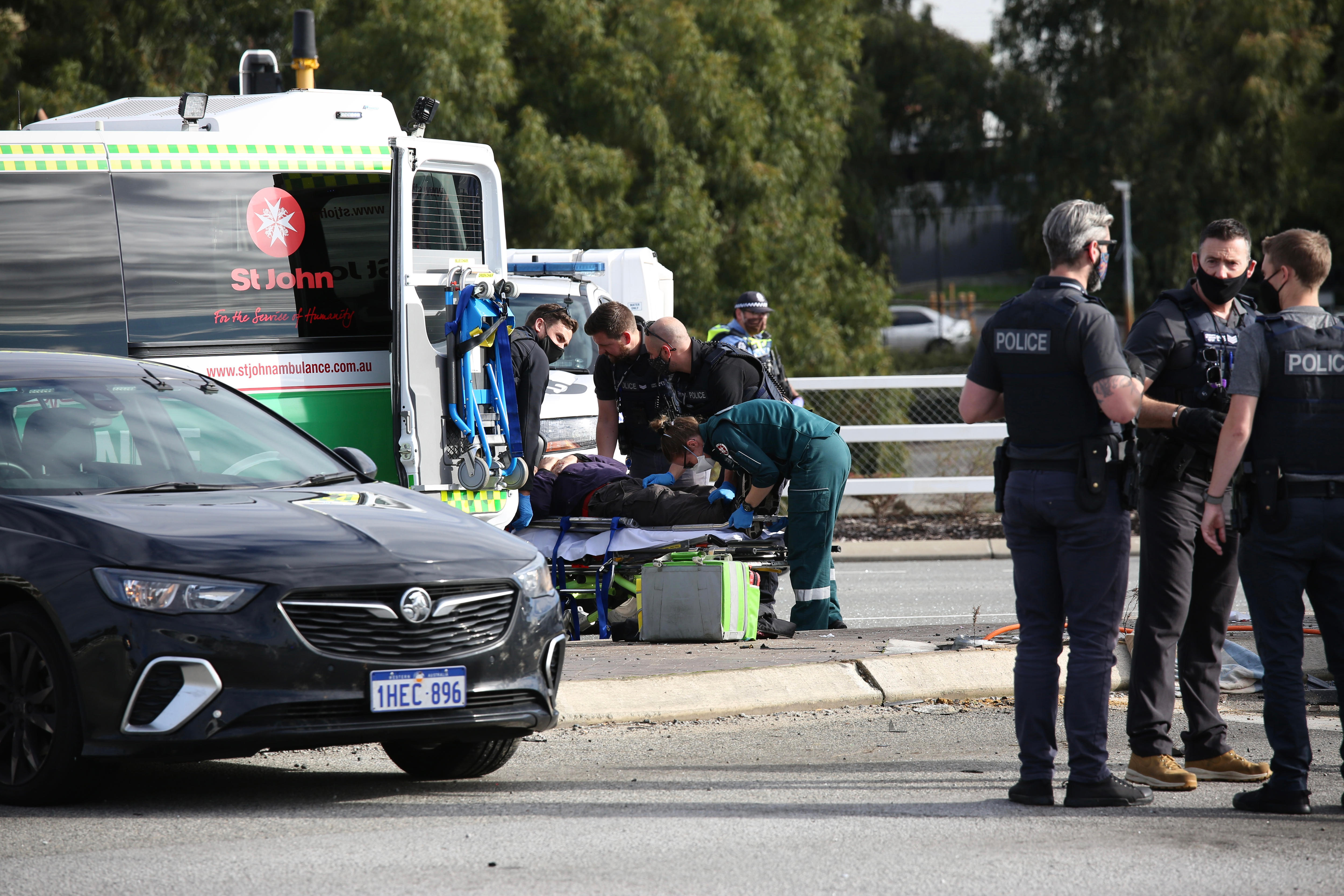 Car pursued by police smashes into East Perth traffic light pole causing multivehicle crash