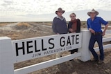 The Patersons with the Hells Gate sign