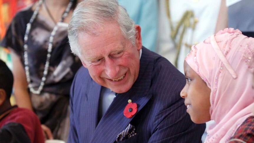 Prince Charles talks to a child