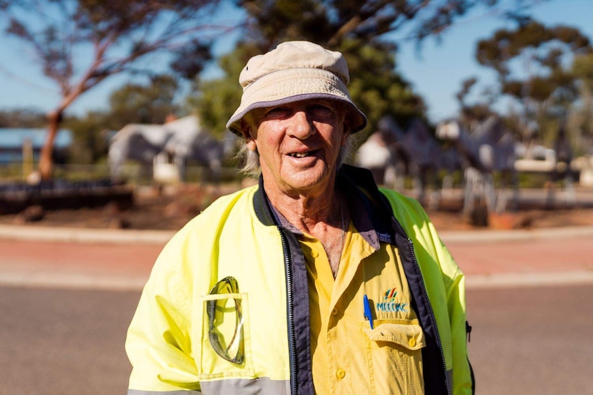 Gary Carroll standing on a Norseman Street wearing a hat.