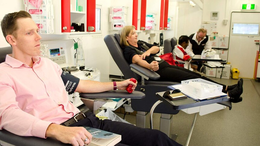 Locals attend a mobile Red Cross blood drive at Logan City Council