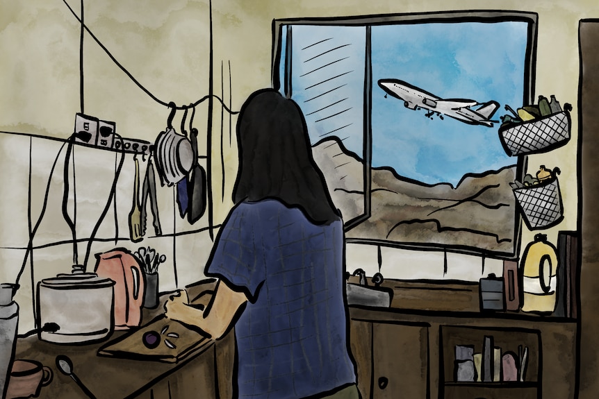 An illustration of a woman with dark hair standing in her kitchen looking out the window at a plane flying overhead.