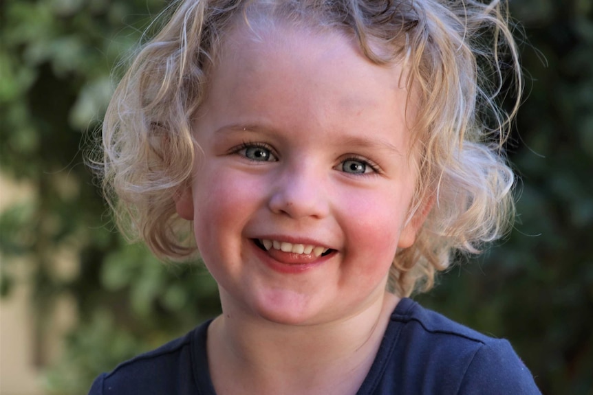 A tight head shot of a young girl.