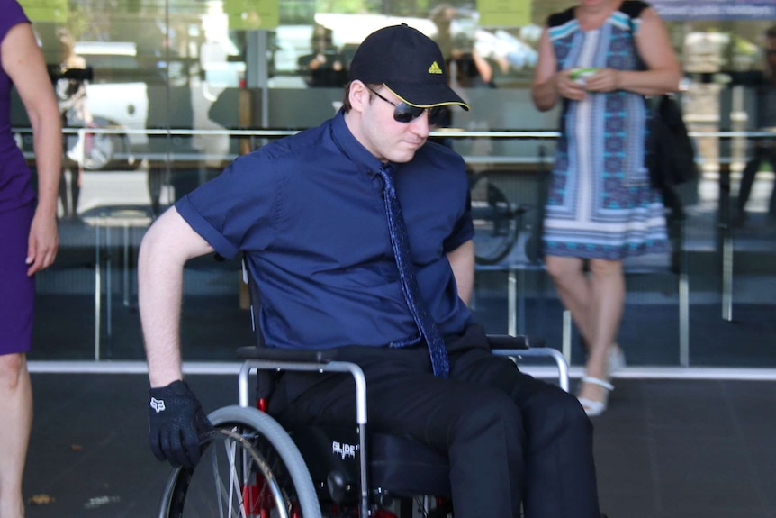 Daniel Ashley leaves the Fremantle Magistrates Court in a wheelchair.