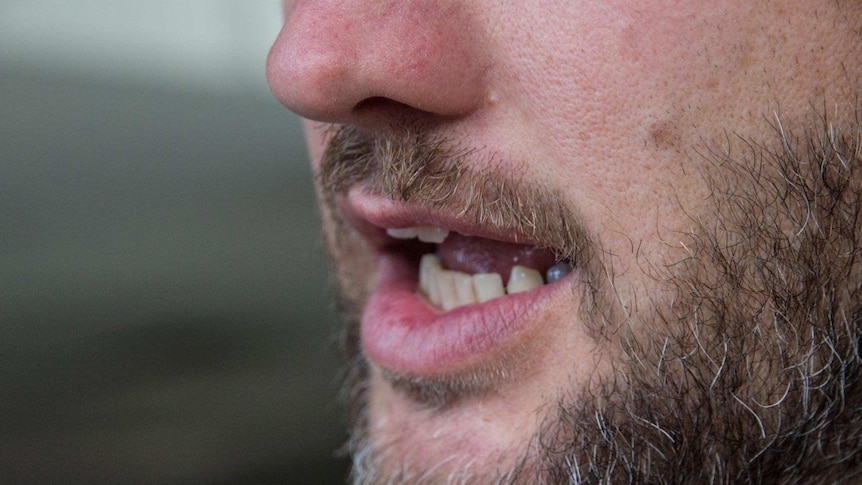 Close up of a human mouth.