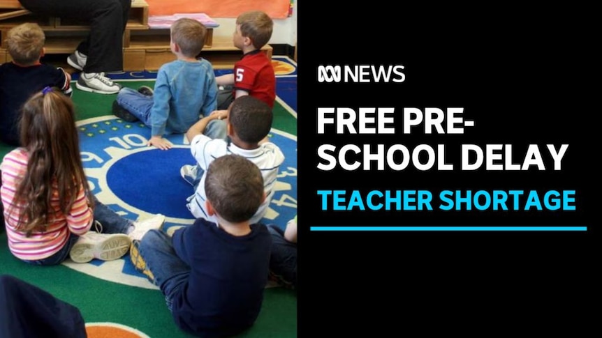 Free Pre-School Delay, Teacher Shortage: Small kids sit on a mat facing an unseen teacher.