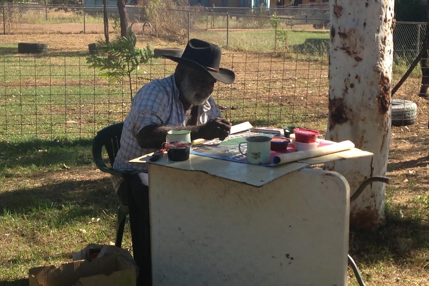 Garawa elder Jack Green works on his paintings.
