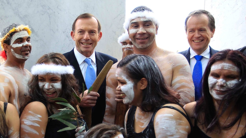 Tony Abbott and Bill Shorten with Indigenous dancers outside Parliament House