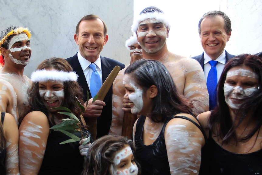Tony Abbott and Bill Shorten with Indigenous dancers outside Parliament House