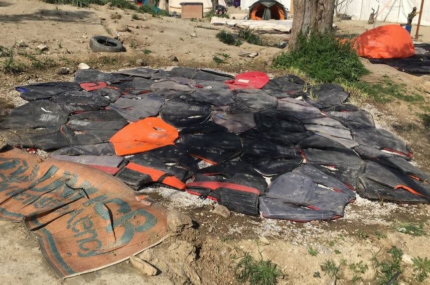 Life jackets used as tent ground sheets