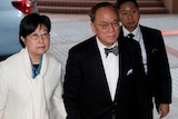 Donald Tsang arrives at court with his wife.