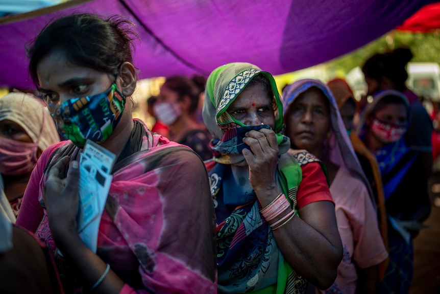 Indian women in colourful clothing. 