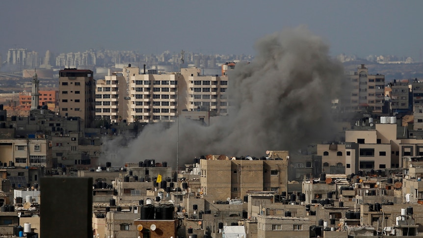 Smoke rises following an Israeli airstrike, in Gaza City, Thursday, May 20, 2021.
