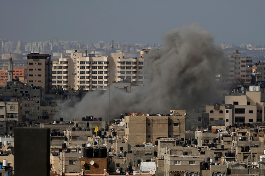 Smoke rises following an Israeli airstrike, in Gaza City, Thursday, May 20, 2021.