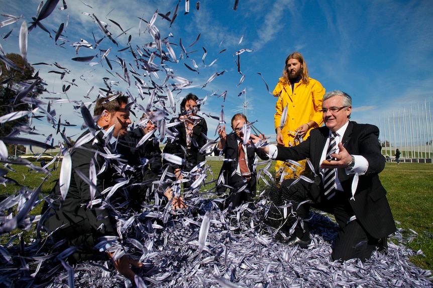 Independent MP Andrew Wilkie and Australian Greens Senator Peter Whish-Wilson join fish protest.