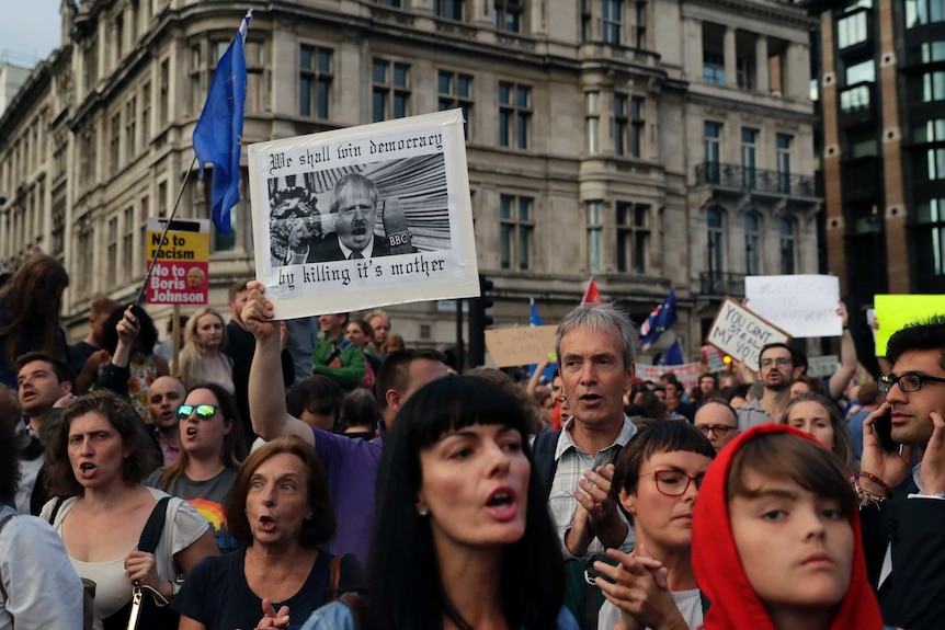 Anti-Brexit supporters gather outside the Prime Minister's residence 10 Downing Street in London.