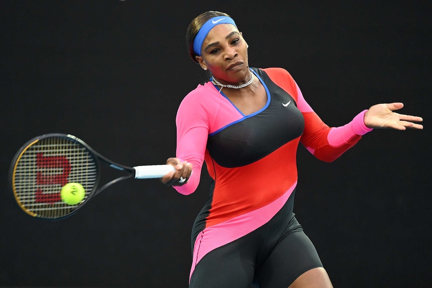 Serena Williams plays a forehand return against Simona Halep at the Australian Open.