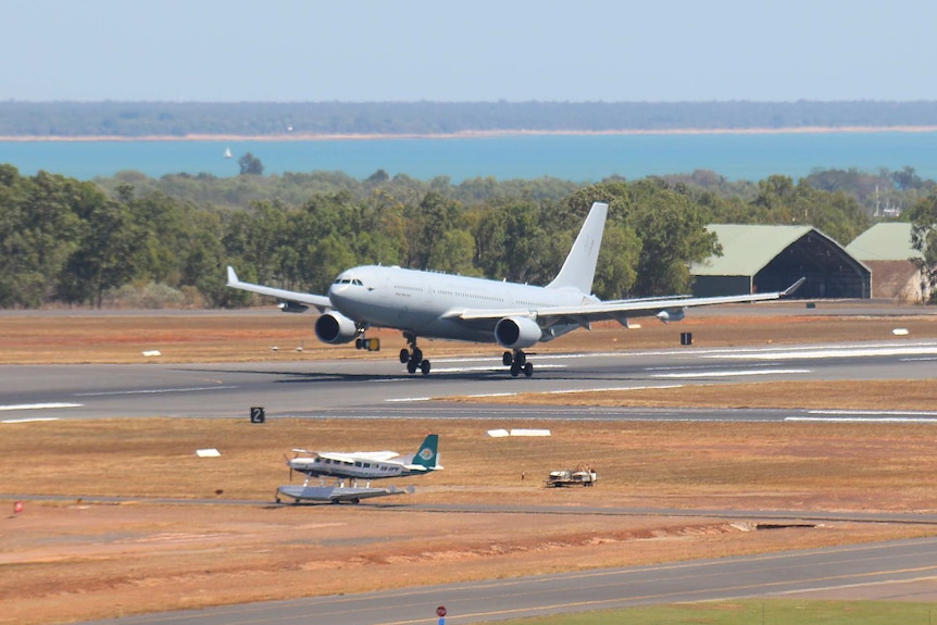An A330 MRTT lands at Darwin, as a Cessna C208 float plane waits for its turn.