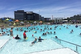 People cooling off from the heat at Springfield, west of Brisbane