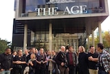 Fairfax staff members gather outside the company's Melbourne headquarters.