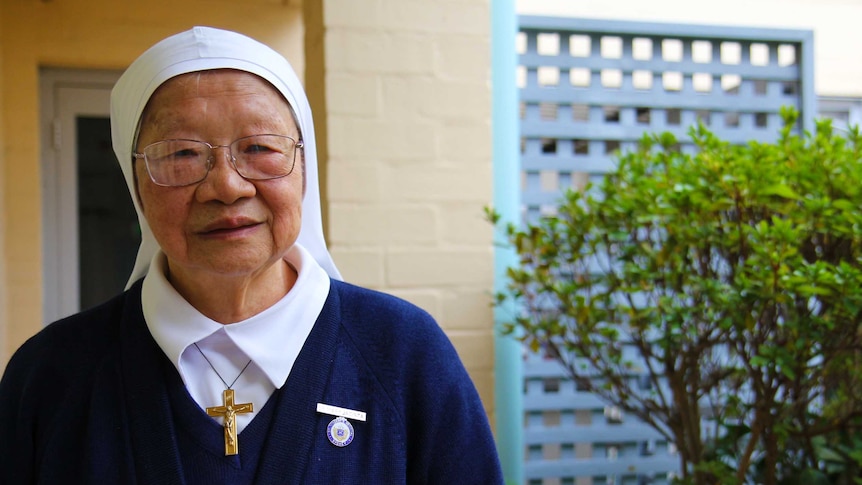 Sister Jacinta Fong stands in the garden of the Darlinghurst convent.