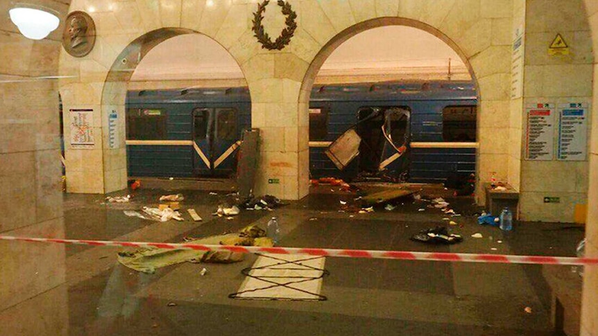 Passengers try to escape after an explosion on a train in St Petersburg