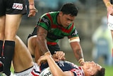 South Sydney's Isaac Luke comforts the Roosters' Sonny Bill Williams at the Olympic stadium.