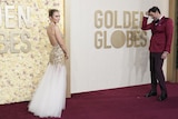 Emily Blunt smiles on red carpet at Golden Globes
