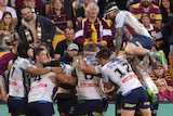 Gold Coast Titans celebrate their momentous win over Melbourne