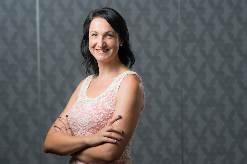 Woman with dark hair smiling