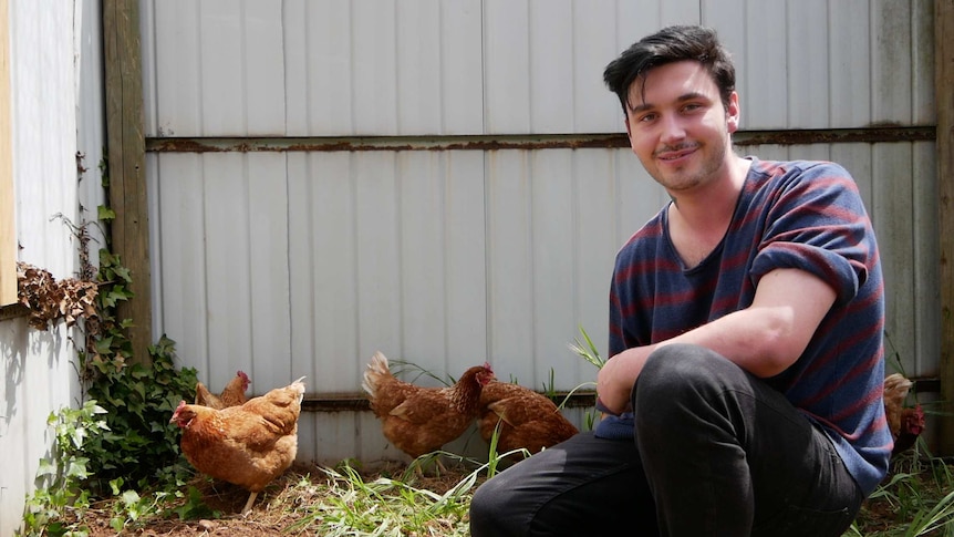 William Gibson with chickens at the care farm in Springbourne