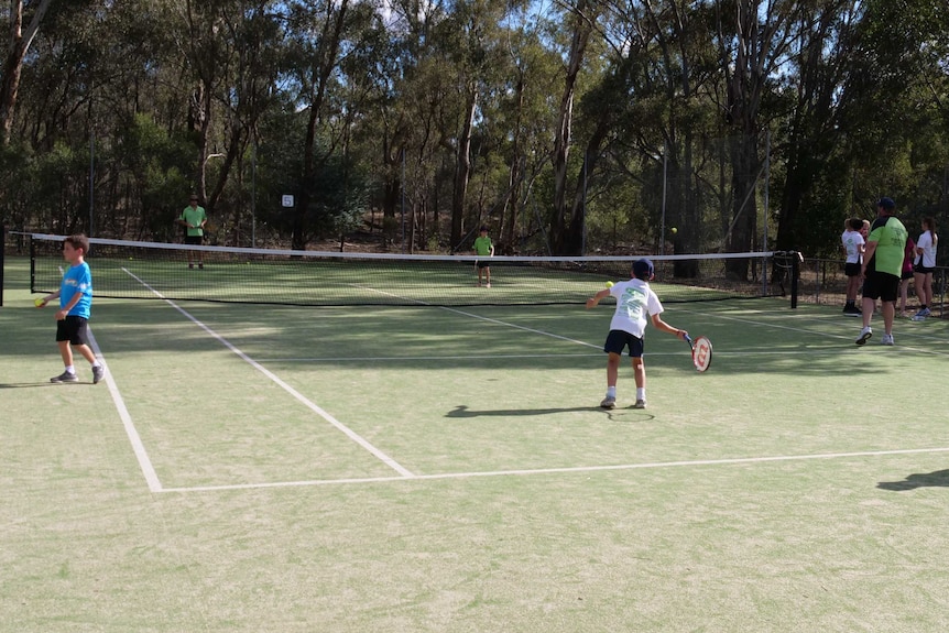 Children playing tennis