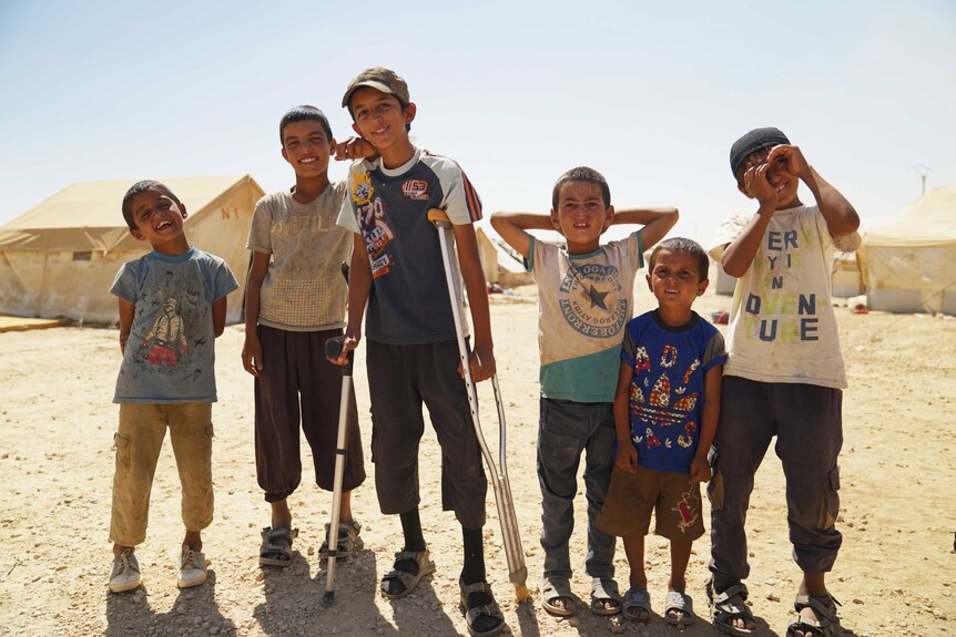 Six young boys in the al-Hawl camp in Syria