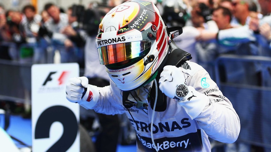 Lewis Hamilton celebrates winning in Malaysia