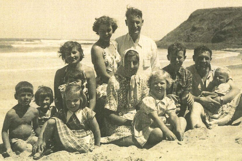 A family gathered at the beach.