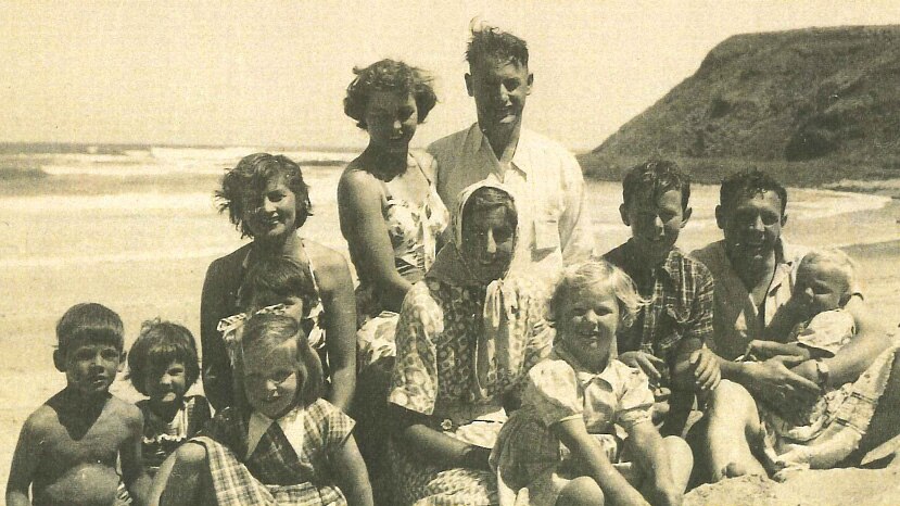 A family gathered at the beach.