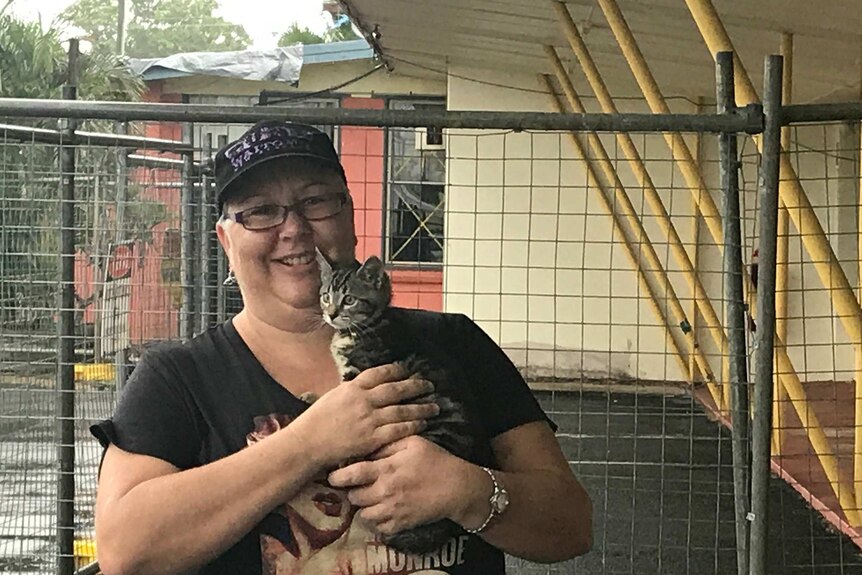 Kristy Haslam and her kitten brace for Tropical Cyclone Iris at her motel in Proserpine on April 4, 2018.