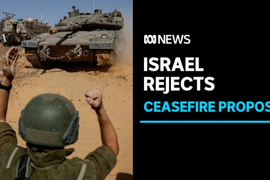 Israel Rejects, Ceasefire Proposal: A soldier with his back to the camera signals to an oncoming tank.