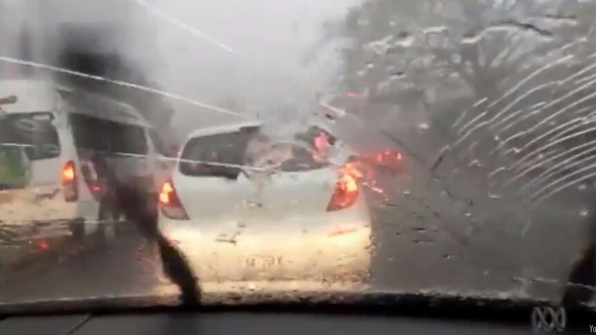 Hail cracks a windscreen during storms in Brisbane, November 27, 2014.