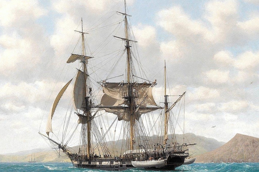 A painting of a tall ship on the ocean with land visible behind it.