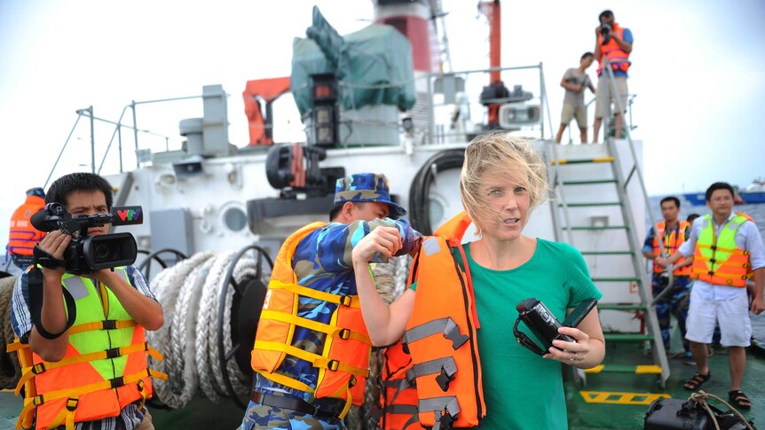 Journalists on the deck of Vietnamese coastguard ship
